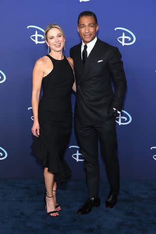 <p>Dia Dipasupil/Getty</p> Amy Robach and TJ Holmes attend the 2022 ABC Disney Upfront at Basketball City - Pier 36 - South Street on May 17, 2022 in New York City