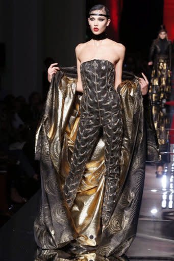 US model Karlie Kloss presents a creation by French designer Jean-Paul Gaultier during the Haute Couture Fall-Winter 2012-2013 collections shows in Paris