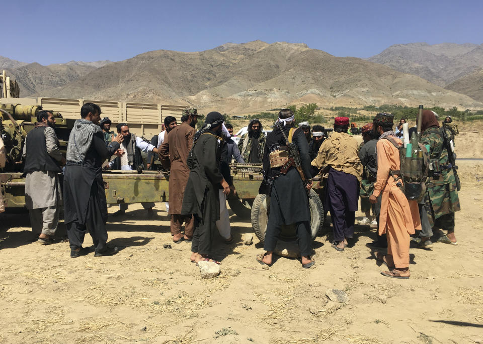 Taliban soldiers gather with weapons and machinery in Panjshir province northeastern of Afghanistan, Wednesday, Sept. 8, 2021. (AP Photo/Mohammad Asif Khan)