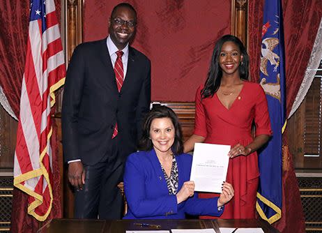 Michigan state Rep. Kyra Harris Bolden (right), here with Lt. Gov. Garlin Gilchrist II and Gov. Gretchen Whitmer, during Bolden's first bill signing. She studied politics and law after learning her great-grandfather had died in a lynching. Photo taken in Lansing, MI. (Photo: Photo courtesy of Kyra Bolden Harris)