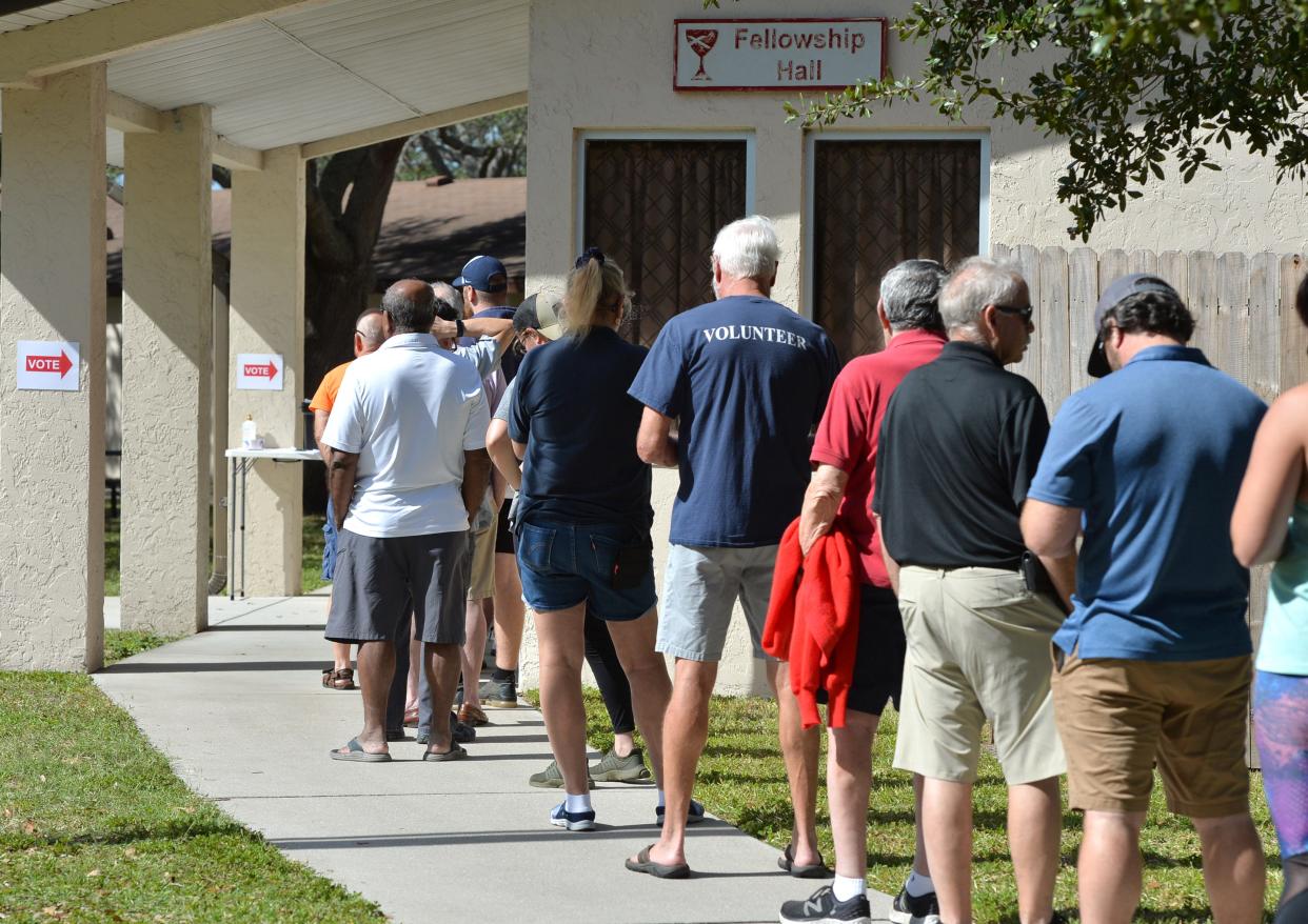 Voters wait in line on Election Day, Nov. 8, at the polling place at Beneva Christian Church, in Sarasota. Shortly after lunch, the wait was about 20 minutes.