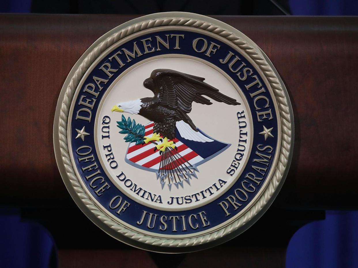 The Justice Department seal is seen on the lectern during a Hate Crimes Subcommittee summit on 29 June 2017 in Washington, DC: (Getty Images)