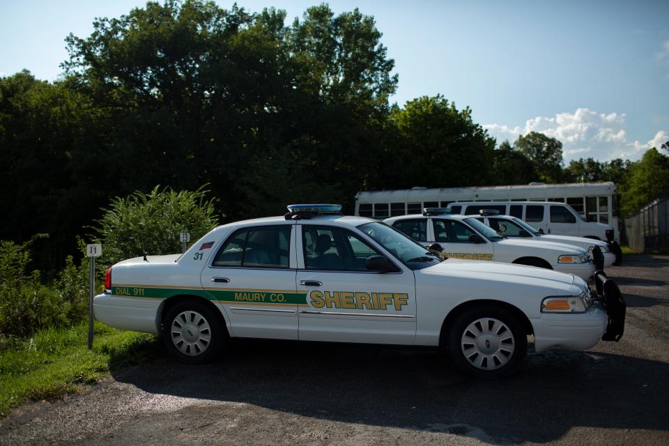 Maury County Sheriff's Department patrol cars rest near the Maury County Jail in Columbia, Tenn., on Thursday, Aug. 19, 2021.