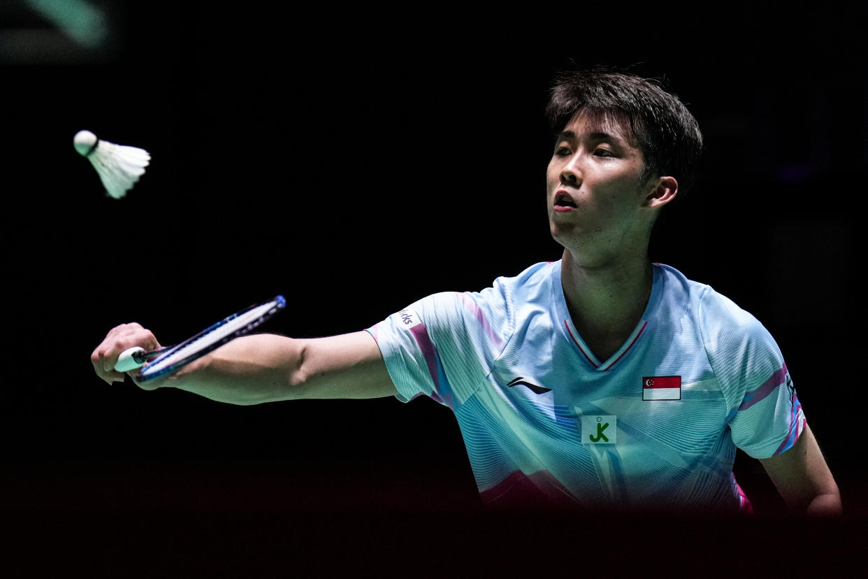 Singapore shuttler Loh Kean Yew returns a shot at the 2022 BWF World Championships. 