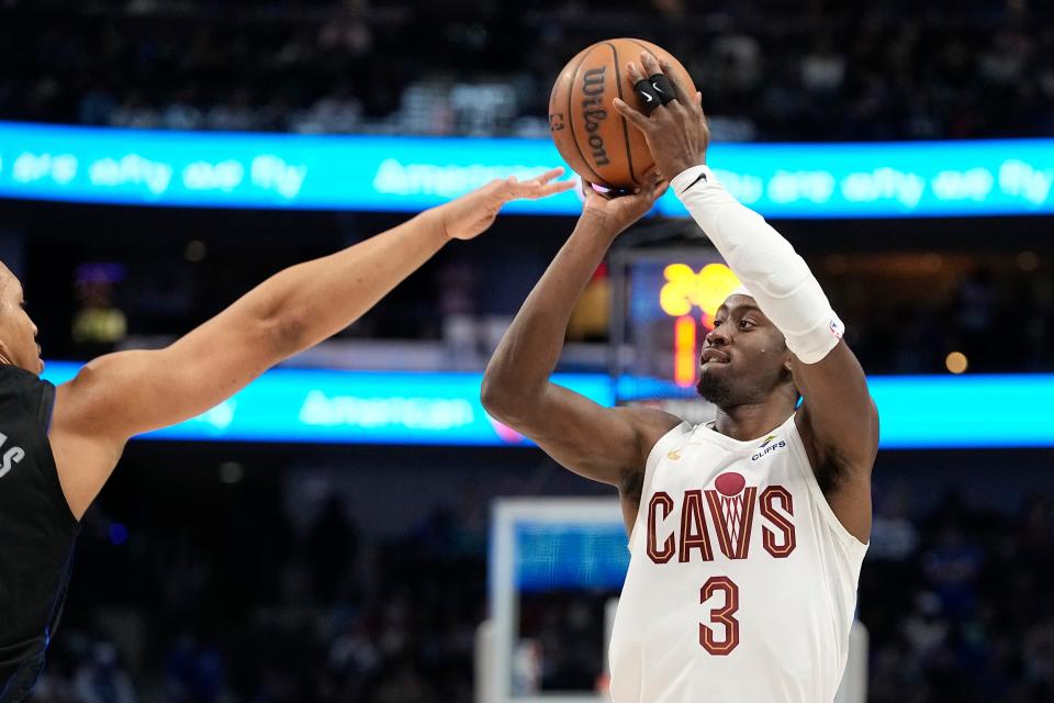 Cavaliers guard Caris LeVert shoots over Mavericks forward Grant Williams during the second half in Dallas on Dec. 27, 2023.