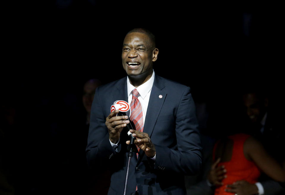 Former Atlanta Hawks player Dikembe Mutombo speaks during a halftime ceremony retiring his number during an NBA basketball game between the Hawks and the Boston Celtics on Tuesday, November 24, 2015 in Atlanta. (AP Photo/David Goldman)