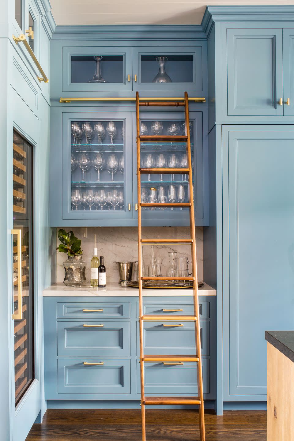 <p>When you have more vertical space than floor space, build up. Take note of this Sommelier-meets-librarian dream designed by <a href="https://www.housebeautiful.com/design-inspiration/house-tours/a33930934/caren-rideau-california-kitchen-tour/" rel="nofollow noopener" target="_blank" data-ylk="slk:Caren Rideau;elm:context_link;itc:0;sec:content-canvas" class="link ">Caren Rideau</a>. </p>