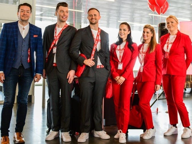 PLAY CEO Birgir Jónsson (left) with cabin crew.