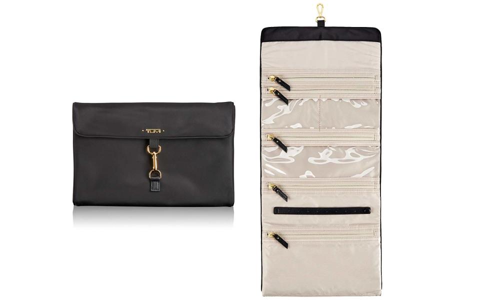 <p>This light and chic travel roll has multiple interior pockets and special earring holders.</p> <p>To buy: <a rel="nofollow noopener" href="https://click.linksynergy.com/fs-bin/click?id=93xLBvPhAeE&subid=0&offerid=492483.1&type=10&tmpid=23821&RD_PARM1=https%3A%2F%2Fwww.tumi.com%2Fp%2Fjewelry-travel-roll-0481899D&u1=TLTRVG1JewelryCasesDZJun17" target="_blank" data-ylk="slk:tumi.com;elm:context_link;itc:0;sec:content-canvas" class="link ">tumi.com</a>, $95</p>