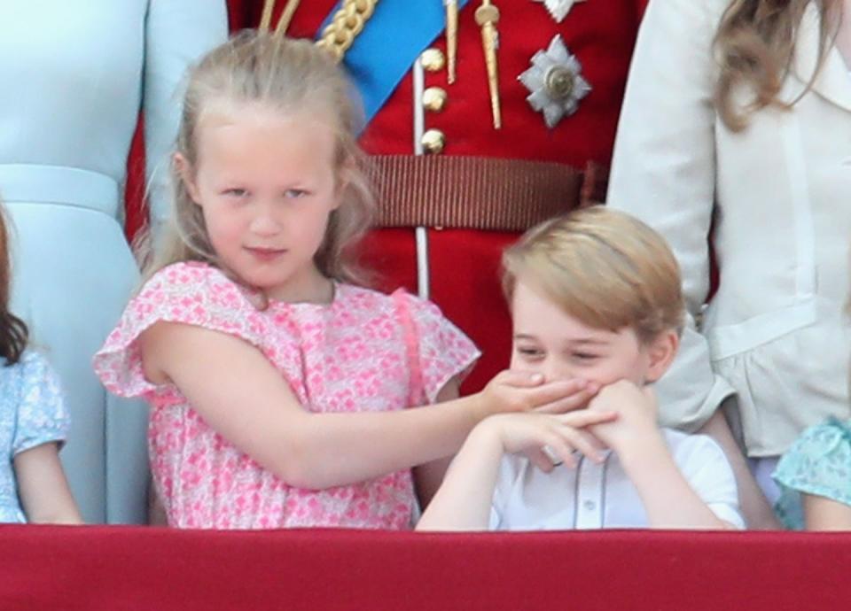 <p>Savannah Phillips jokingly covered Prince George's mouth during the singing of "God Save the Queen." More on that cute moment right this way.</p>