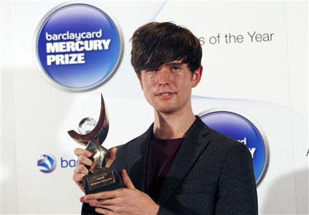 Musician James Blake, winner of the 2013 Mercury Music Prize, poses for a photograph after the ceremony in north London, October 30, 2013. REUTERS/Olivia Harris