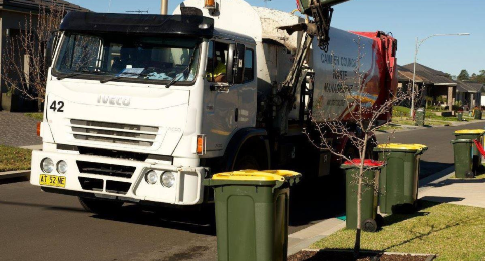 A truck collecting rubbish.