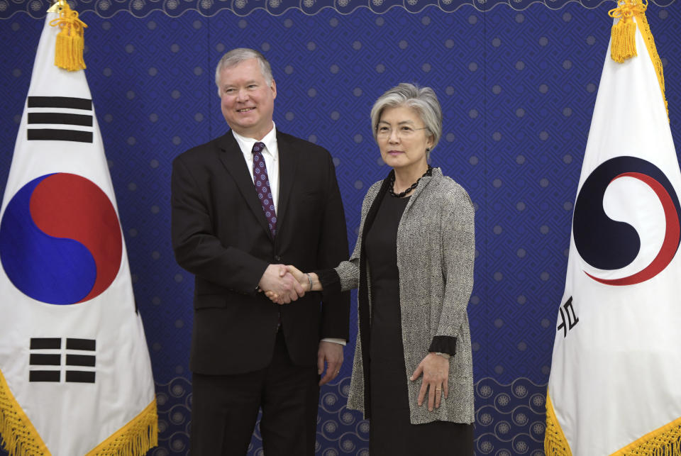 U.S. Special Representative for North Korea Stephen Biegun, left, shakes hands with South Korea's Foreign Minister Kang Kyung-wha during their meeting at the foreign ministry in Seoul Friday, May 10, 2019. Thursday's launches of projectiles in North Korea came as Biegun visited South Korea, and hours after the North described its firing of rocket artillery and an apparent short-range ballistic missile on Saturday as a regular and defensive military exercise. (Jung Yeon-je/Pool Photo via AP)