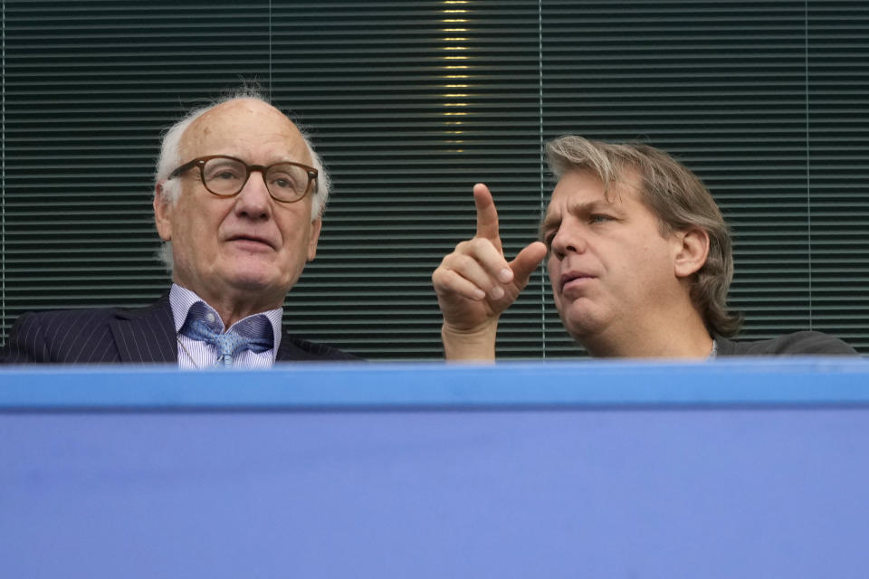 Chelsea new owner Todd Boehly, right, talks during the English Premier League soccer match between Chelsea and Wolverhampton at Stamford Bridge stadium, in London, Saturday, May 7, 2022. (AP Photo/Frank Augstein)