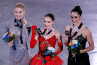 Figure Ice Skating - ISU Grand Prix of Figure Skating Final - Ladies Victory Ceremony - Nagoya, Japan - December 9, 2017. Silver medalist Maria Sotskova of Russia, gold medalist Alina Zagitova of Russia and bronze medalist Kaetlyn Osmond of Canada show their medals. REUTERS/Issei Kato