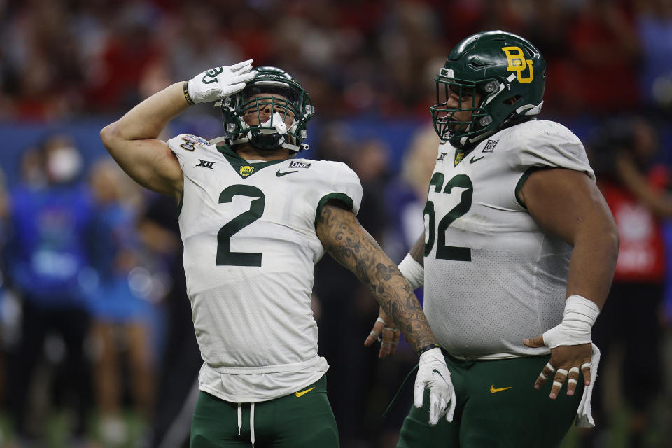 NEW ORLEANS, LOUISIANA - JANUARY 01: Terrel Bernard #2 and Siaki Ika #62 of the Baylor Bears celebrate a sack against the Mississippi Rebels during the fourth quarter in the Allstate Sugar Bowl at Caesars Superdome on January 01, 2022 in New Orleans, Louisiana. (Photo by Chris Graythen/Getty Images)