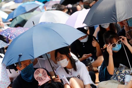 Students stage a rally to call for political reforms outside City Hall in Hong Kong