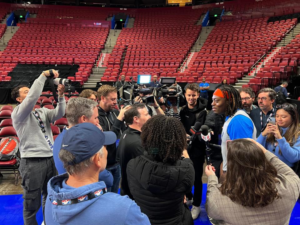 Luguentz Dort surrounded by reporters at the Thunder's shootaround Thursday morning.