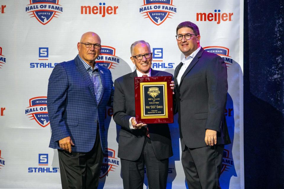 Mike "Doc" Emrick (center) is inducted into the Michigan Sports Hall of Fame at Sound Board at MotorCity Casino Hotel in Detroit on Thursday, Sept. 14. Alongside Emrick are MHSOF Chairman Scott Lesher (left) and President Jordan Field (right).