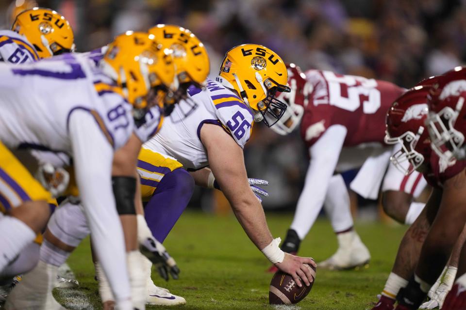 Nov 13, 2021; Baton Rouge, Louisiana, USA; LSU Tigers center Liam Shanahan (56) prepares to snap the ball at the line of scrimmage against the Arkansas Razorbacks at Tiger Stadium. Mandatory Credit: Kirby Lee-USA TODAY Sports