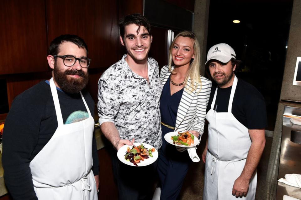 RJ Mitte and Joelle Posey get salads prepared by Chefs Vinny Dotolo (left) and Jon Shook of Jon & Vinny’s during E!’s The Arrangement Event on February 15, 2017 in Los Angeles, California (Photo by Matt Winkelmeyer/Getty Images for E! Entertainment)