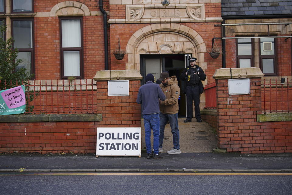 People at Castlemere Community Centre in Rochdale, Britain, Thursday Feb. 29, 2024, as voting begins in the Rochdale by-election which was triggered after the death of Labour MP Sir Tony Lloyd. (Peter Byrne/PA via AP)