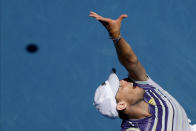 Austria's Dominic Thiem serves to France's Gael Monfils during their fourth round singles match at the Australian Open tennis championship in Melbourne, Australia, Monday, Jan. 27, 2020. (AP Photo/Andy Wong)