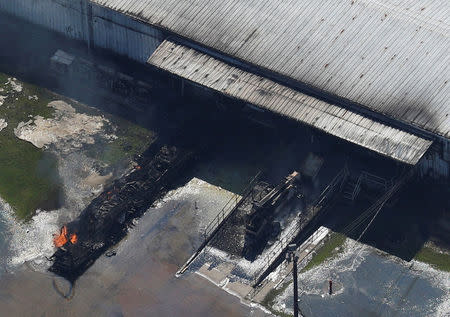 FILE PHOTO: A fire burns at the flooded plant of French chemical maker Arkema SA after Tropical Storm Harvey passed in Crosby, Texas, U.S. August 31, 2017. REUTERS/Adrees Latif