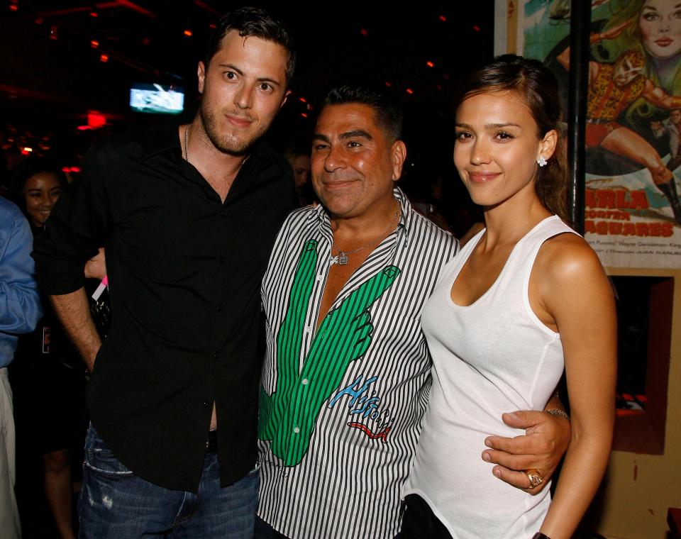 \In this June 28, 2007 file photo, Harry Morton, left, Luis Barajas, center, founder of Flaunt magazine, and Jessica Alba are seen at the opening of the Pink Taco restaurant in Los Angeles.