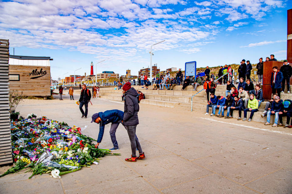 Friends and family lay flowers on the beach at Scheveningen.