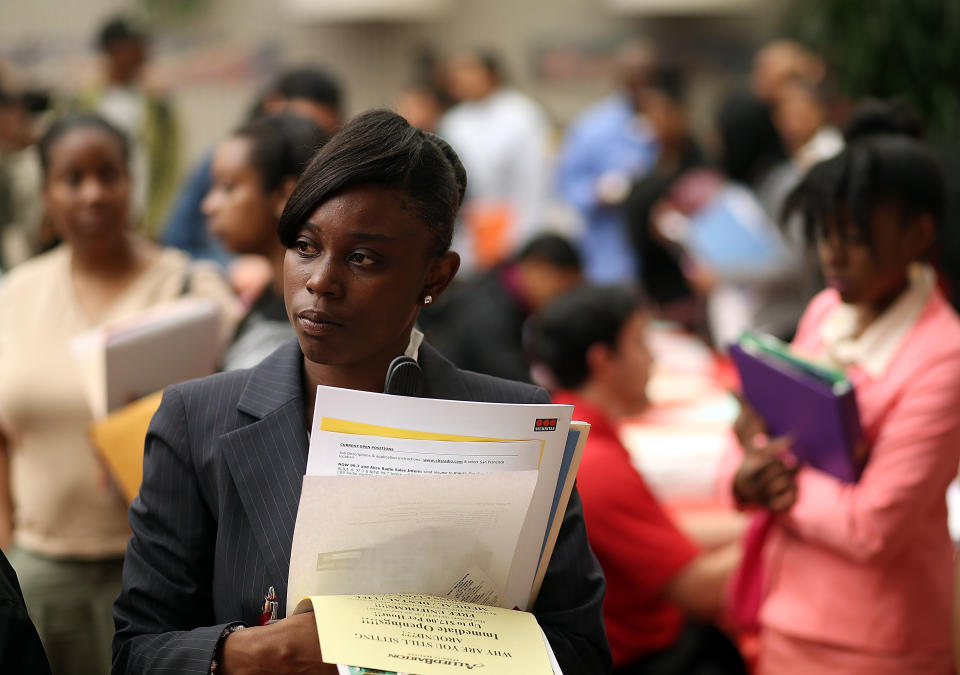 SAN FRANCISCO, CA - MAY 30:  Job seekers wait in line to meet with a recruiter during a job and career fair at City College of San Francisco southeast campus on May 30, 2013 in San Francisco, California.  Hundreds of job seekers attended a career fair hosted by the San Francisco Southeast Community Facility Commission.  (Photo by Justin Sullivan/Getty Images)