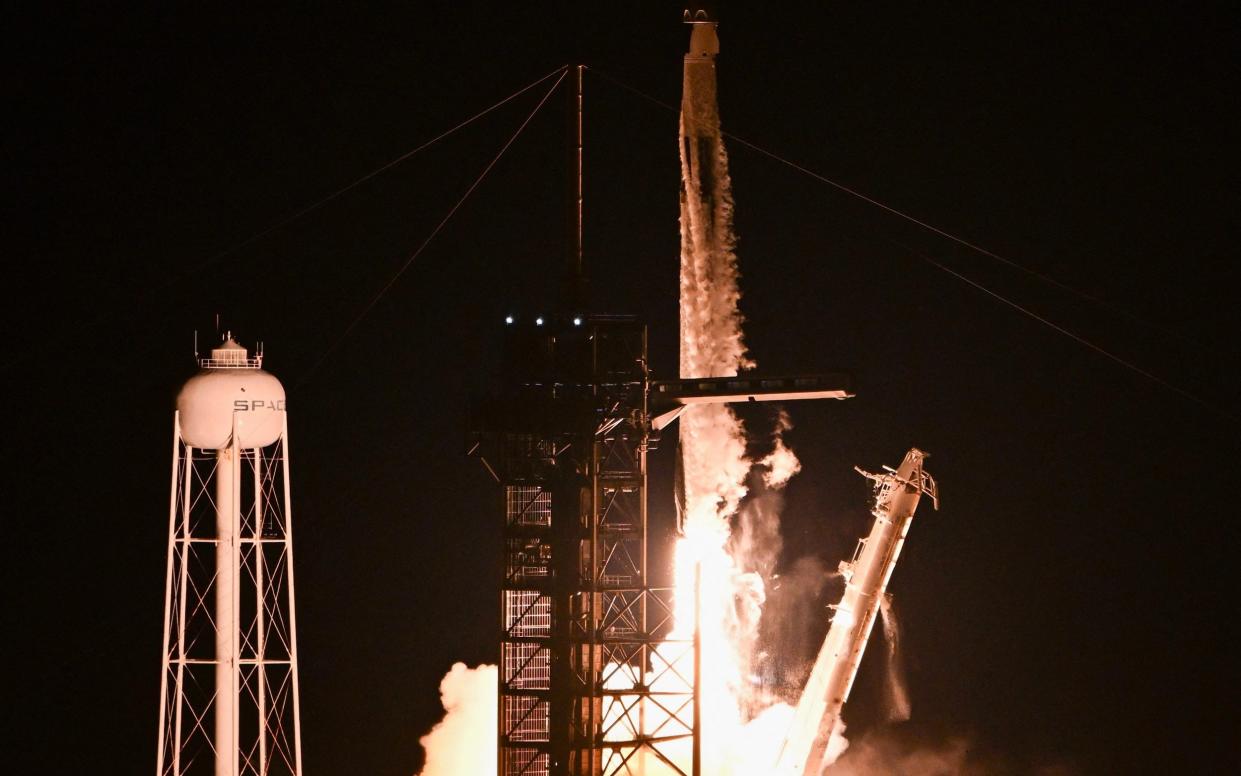 A SpaceX Falcon 9 rocket with the Crew Dragon Resilience capsule