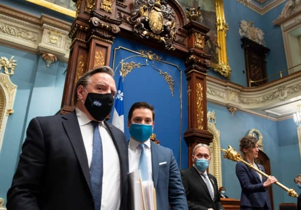 Quebec Premier François Legault, left, and Quebec Minister Responsible for French Language Simon Jolin-Barrette. The government has promised to update the province's language laws in the coming months. (Jacques Boissinot/The Canadian Press - image credit)