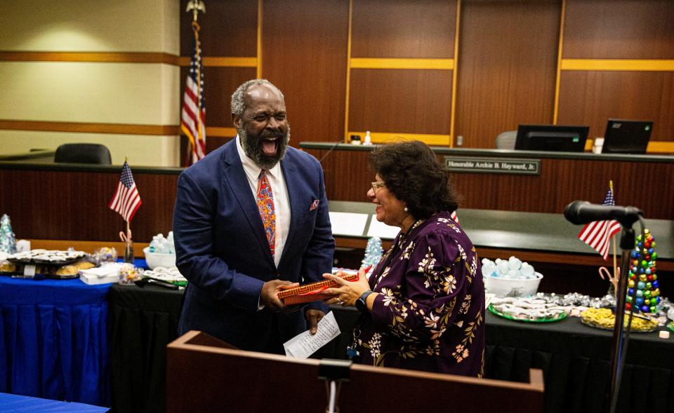 Judge Archie Hayward Jr. reacts as he is given a gift by Judge Josephine Gagliardi at his farewell party at the Lee County Courthouse on Friday, Dec. 2, 2022.