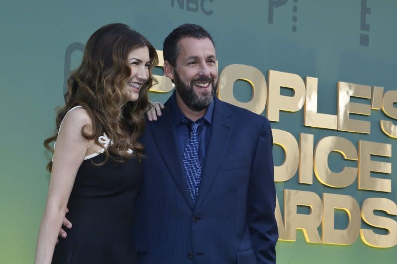 Adam Sandler (R) and Jackie Sandler attend the People's Choice Awards on Sunday. Photo by Jim Ruymen/UPI