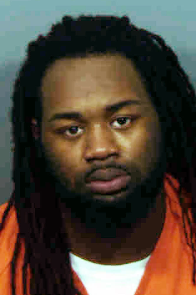 This undated photo provided by the state's attorney's office in Prince George's County, Md., shows Malik Ford. His brother, Michael Ford, is charged with attacking a Maryland police station while his two brothers, Malik Ford and Elijah Ford videotaped the shootout, which led to an officer mistakenly killing an undercover detective. Opening statements are expected to begin Wednesday, Oct. 24, 2018, for Michael Ford’s trial in the 2016 shooting death of Prince George’s County police detective Jacai Colson. (Prince George's County State's Attorney's Office via AP)