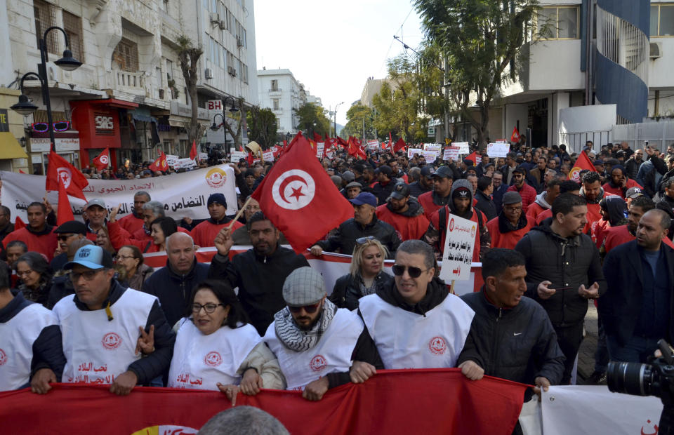 Members of the Tunisian General Labor Union (UGTT) take part in a protest against president Kais Saied policies, in Tunis, Tunisia, Saturday, March 4, 2023. (AP Photo/Hassene Dridi)