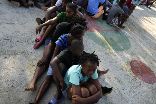 Haitian migrants wait to be processed and receive medical attention at a tourist campground in Sierra Morena, in the Villa Clara province of Cuba, Wednesday, May 25, 2022. A vessel carrying more than 800 Haitians trying to reach the United States wound up instead on the coast of central Cuba, government news media said Wednesday. (AP Photo Ramon Espinosa)