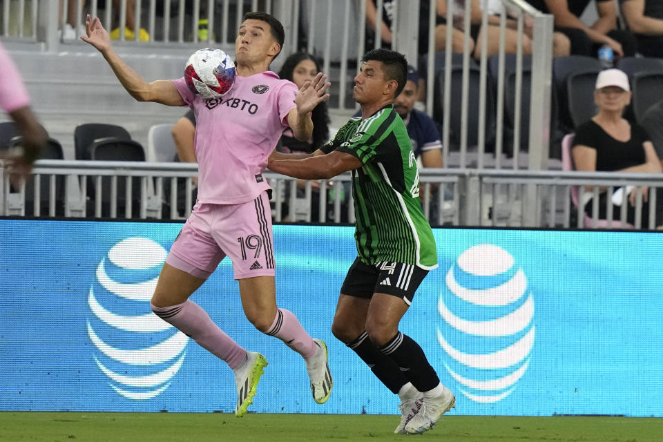 Inter Miami forward Robbie Robinson (19) controls the ball as Austin FC defender Nick Lima (24) defends during the first half of an MLS soccer match, Saturday, July 1, 2023, in Fort Lauderdale, Fla. (AP Photo/Lynne Sladky)