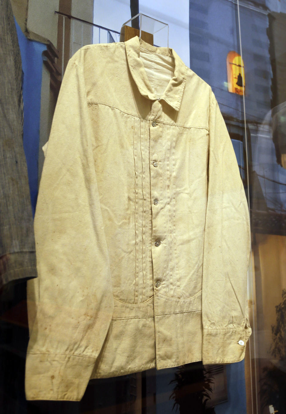 In this Wednesday, Oct. 17, 2012 photo, a guayabera said to have been worn by the Spanish military in 1897 in Cuba, is on display at an exhibition titled "The Guayabera: A Shirt's Story" at the Museum of History Miami, in Miami. This is the first exhibition to trace the story of the shirt's evolution through Cuba, Mexico, and the United States. (AP Photo/Lynne Sladky)