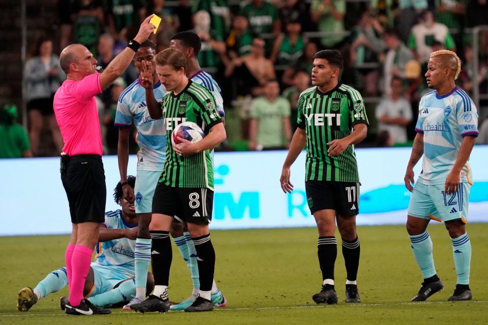 Austin FC midfielder Alex Ring receives a yellow card during Saturday night's 1-1 draw against the Colorado Rapids at Q2 Stadium.