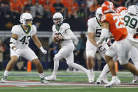 Baylor quarterback Blake Shapen (12) rolls out to pass against Oklahoma State in the first half of an NCAA college football game for the Big 12 Conference championship in Arlington, Texas, Saturday, Dec. 4, 2021. (AP Photo/Tim Heitman)