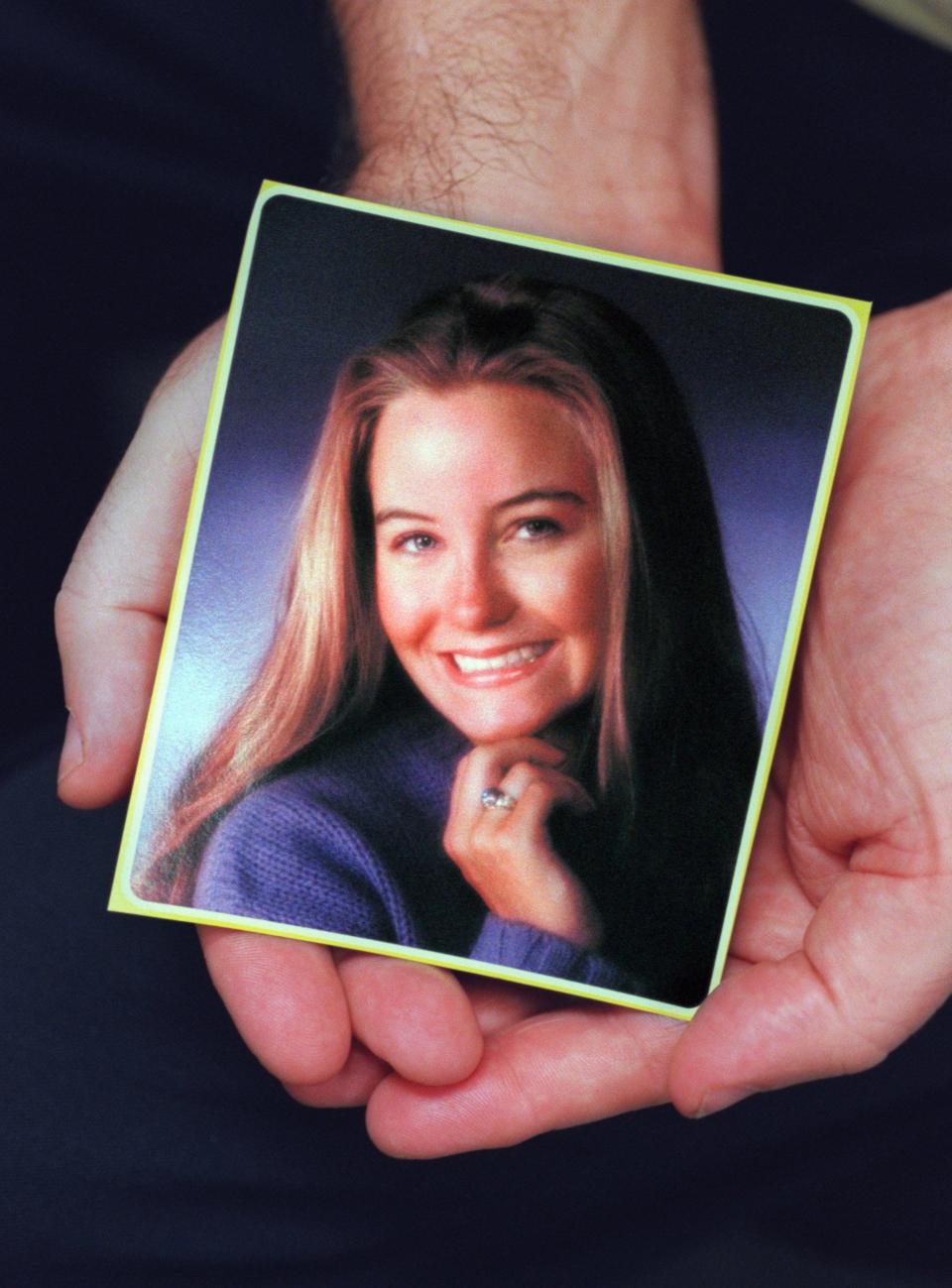 David Easterbrook, of Troy, holds a photo of his daughter Ashley who was killed five days before she would have graduated from Troy High School in 1997.