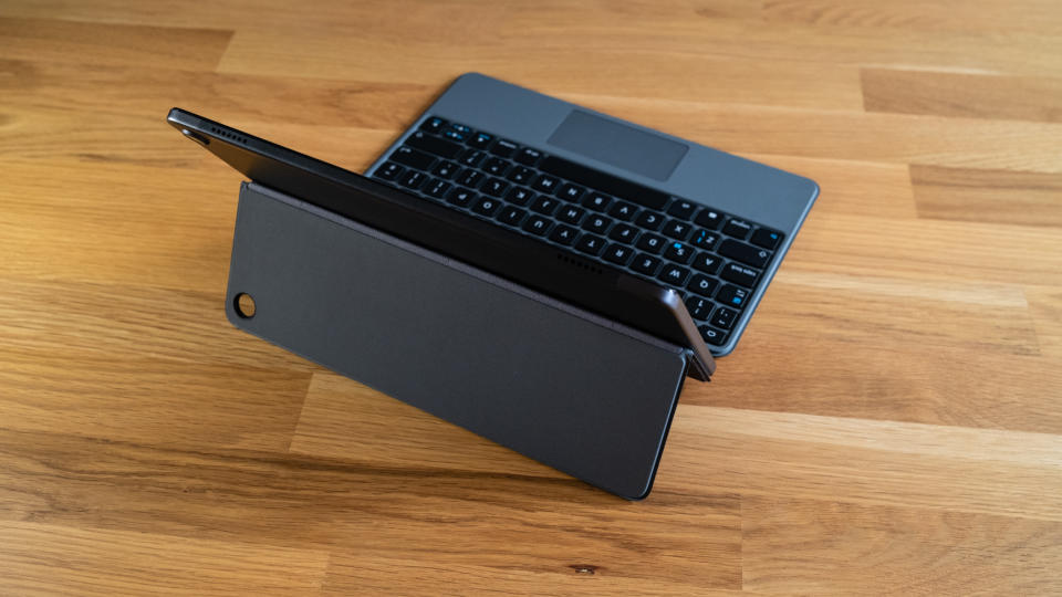 Amazon Fire Max 11 tablet with keyboard attached seen from behind sitting on a wooden surface