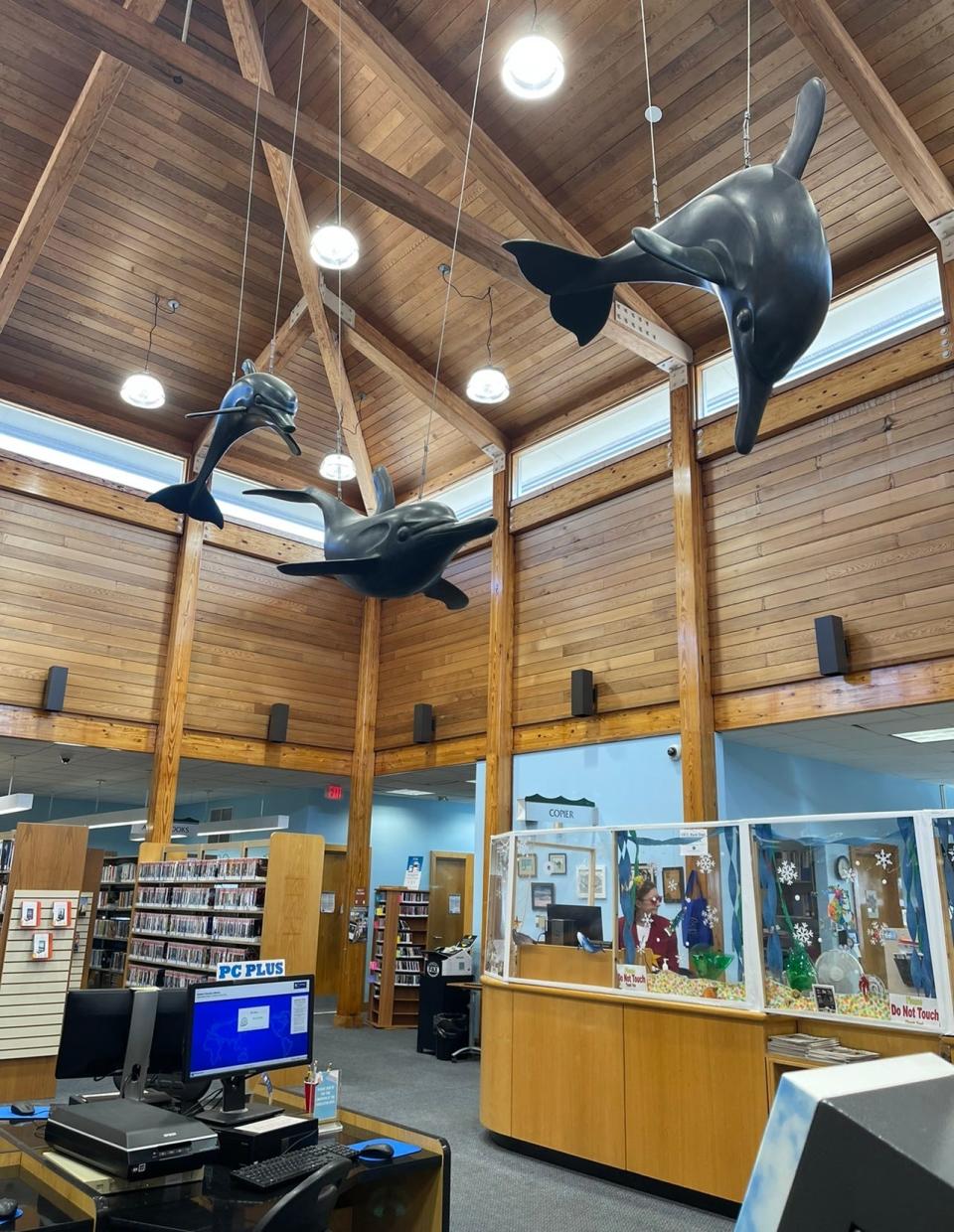 The "Dolphins" sculpture by Michael Shacham, available for viewing at the Long Beach Island Branch of the Ocean County Library, was gifted by "The Friends of the Ocean County Library" in 1990, a year after the location's grand opening.