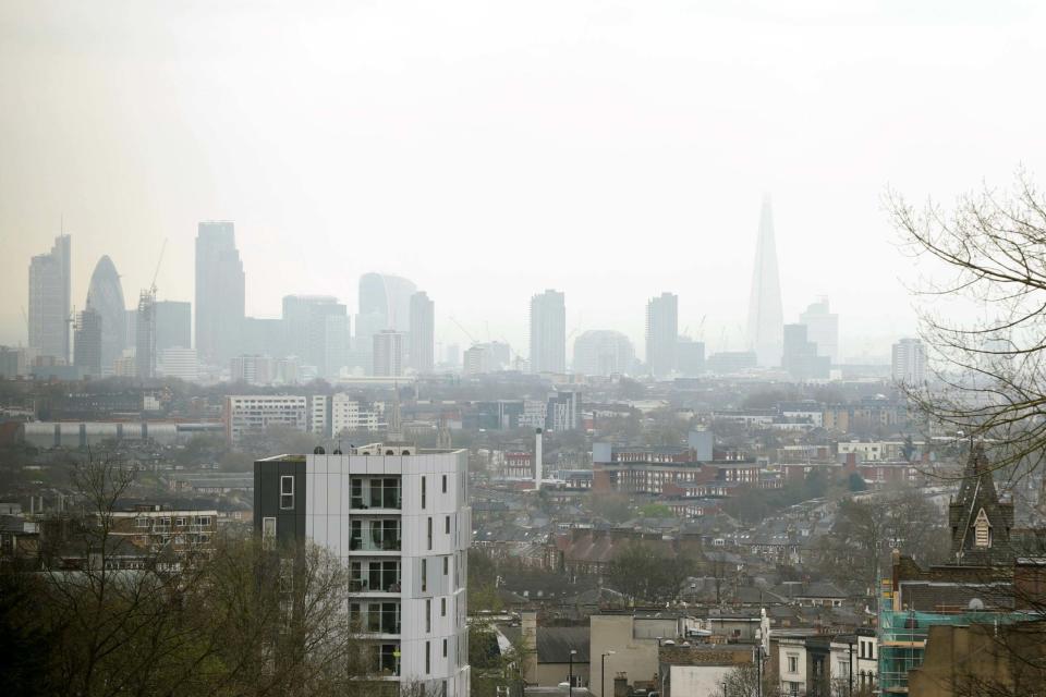 A view of the City of London skyline as seen through a layer of smog. (PA)