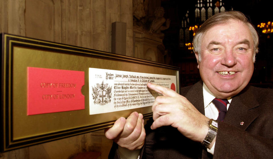 Comedian Jimmy Tarbuck with his copy of the freedom of the 'City of London' scroll, after an official ceremony held at the Guildhall. 