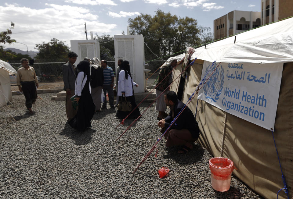 Yemenis wait outside a tent where cholera patients are receiving treatment at Sabaeen Hospital in Sanaa, Yemen, on June 13, 2017.&nbsp; (Photo: MOHAMMED HUWAIS/AFP/Getty Images)