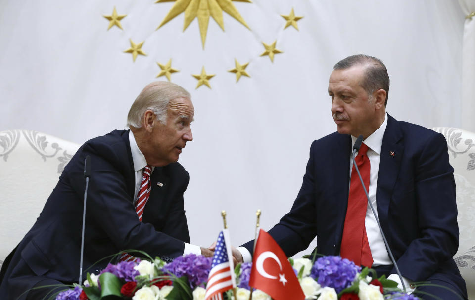 FILE- In this Wednesday, Aug. 24, 2016 file photo, then U. S. Vice President Joe Biden, left, talks to Turkey's President Recep Tayyip Erdogan during a meeting in Ankara, Turkey. Erdogan has toned down his anti-Western and anti-US rhetoric in an apparent effort to reset the rocky relationship with his NATO allies. So far, however, he’s been met by silence from U.S. President Joe Biden. Nearly two months into his presidency, Biden still hasn’t called Erdogan, which some in Turkey see as a worrying sign. (Kayhan Ozer, Presidential Press Service Pool via AP, File)