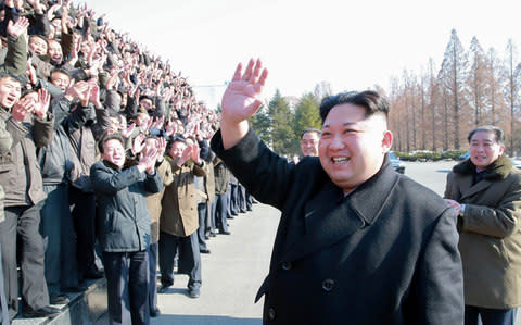 North Korean leader Kim Jong-un visiting the State Academy of Sciences at an undisclosed location - Credit:  AFP